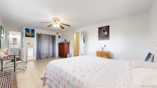 bedroom featuring ceiling fan, light hardwood / wood-style flooring, and ensuite bathroom