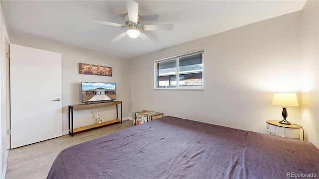 bedroom with ceiling fan and light hardwood / wood-style floors