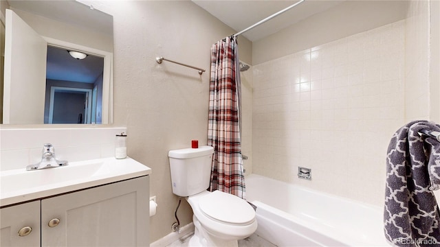 full bathroom with vanity, shower / bath combination with curtain, and toilet