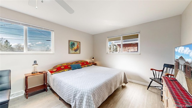 bedroom with ceiling fan and hardwood / wood-style floors