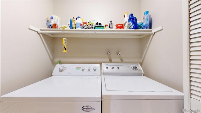 laundry area featuring washing machine and clothes dryer