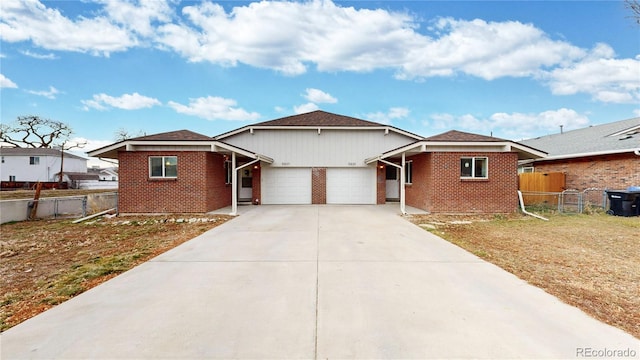 view of front of house featuring a front lawn and a garage