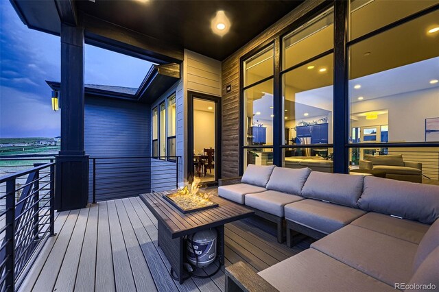 8868 Geyser Peak Way, Parker, CO 80138 - deck featuring an outdoor living space with a fire pit