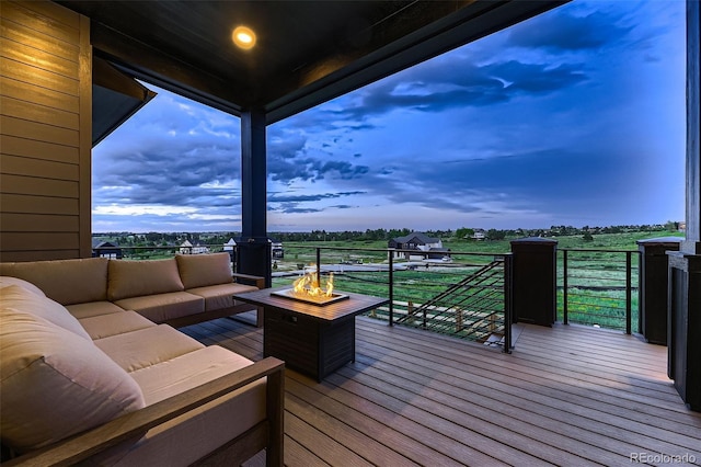 8868 Geyser Peak Way, Parker, CO 80138 - wooden terrace featuring an outdoor living space with a fire pit