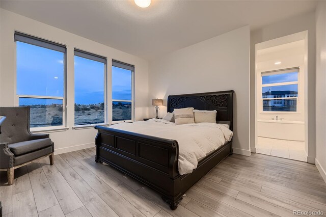 8868 Geyser Peak Way, Parker, CO 80138 - bedroom featuring light wood finished floors and baseboards