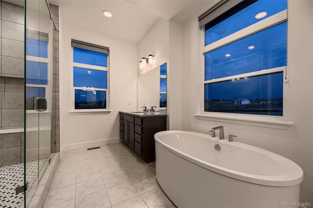 8868 Geyser Peak Way, Parker, CO 80138 - full bath featuring a soaking tub, baseboards, vanity, a shower stall, and recessed lighting