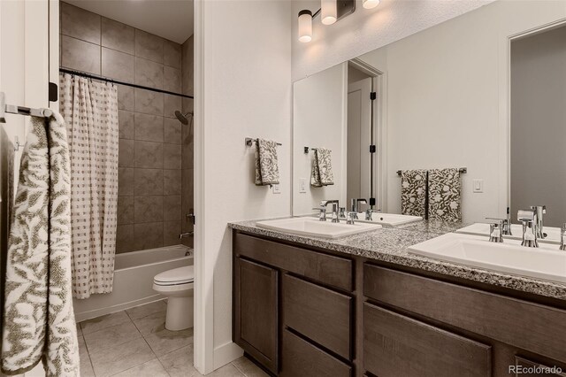 8868 Geyser Peak Way, Parker, CO 80138 - full bathroom with double vanity, tile patterned floors, toilet, and shower / bathtub combination with curtain