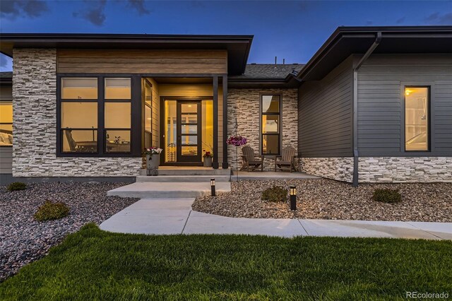 8868 Geyser Peak Way, Parker, CO 80138 - doorway to property featuring stone siding