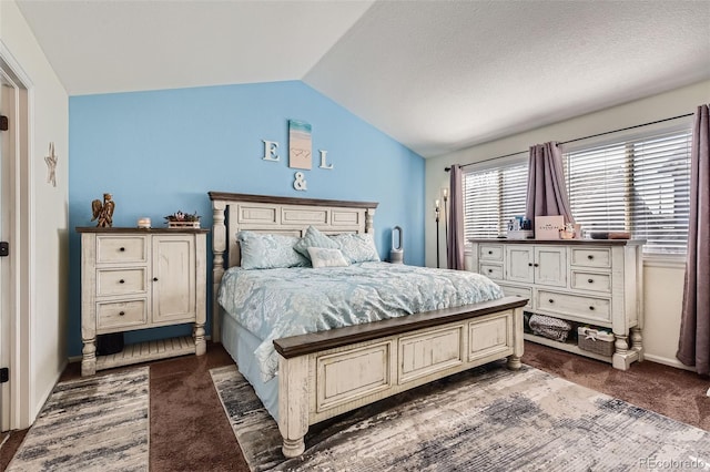 bedroom with vaulted ceiling and carpet floors