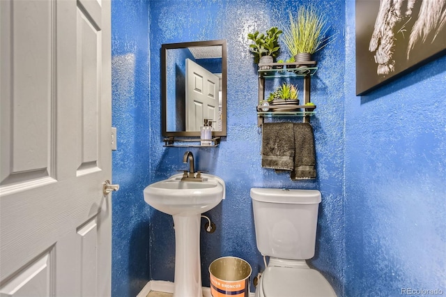 bathroom with sink and toilet