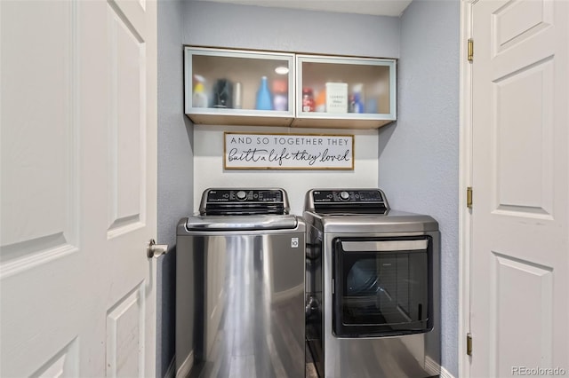 laundry room featuring washing machine and clothes dryer