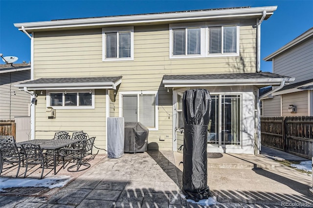 rear view of property featuring a patio