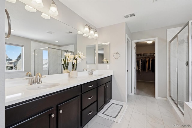16268 Mount Silverheels Way, Broomfield, CO 80023 - full bath featuring marble look tiles, a shower stall, a walk in closet, and double vanity
