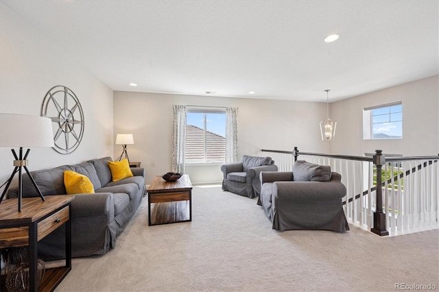 16268 Mount Silverheels Way, Broomfield, CO 80023 - carpeted living room featuring healthy amount of natural light, a chandelier, and recessed lighting