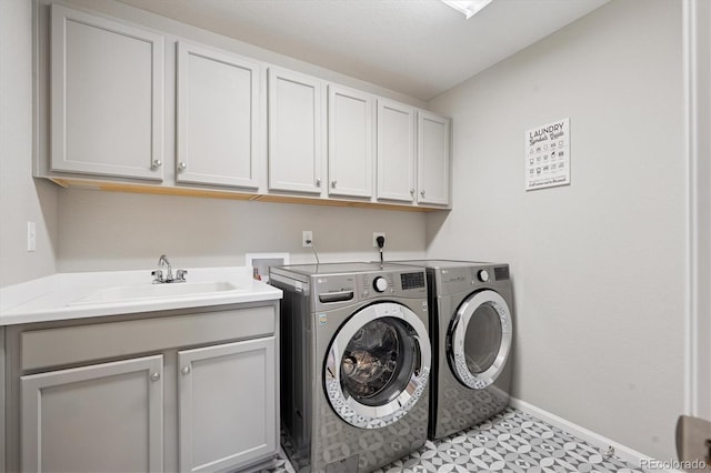 16268 Mount Silverheels Way, Broomfield, CO 80023 - laundry room featuring cabinet space, independent washer and dryer, and baseboards