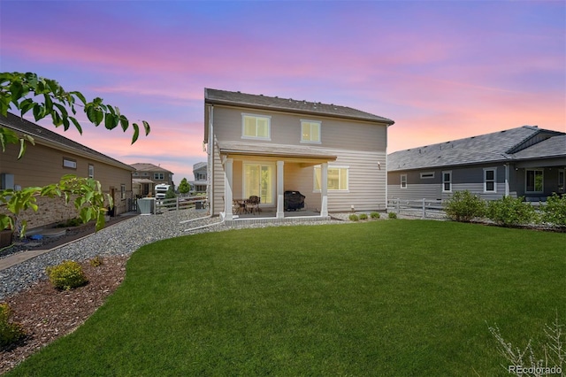 16268 Mount Silverheels Way, Broomfield, CO 80023 - back of property at dusk with a patio