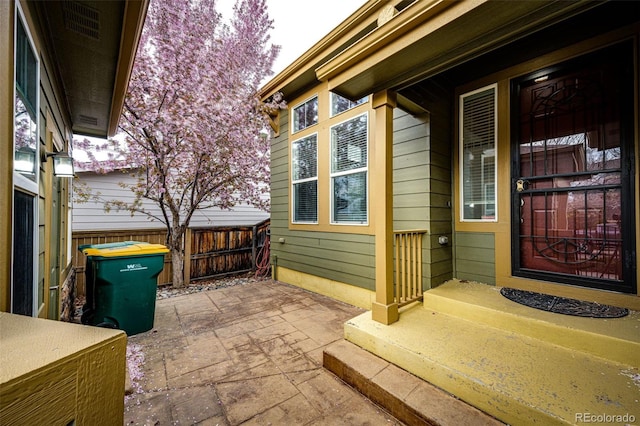 view of patio / terrace featuring fence