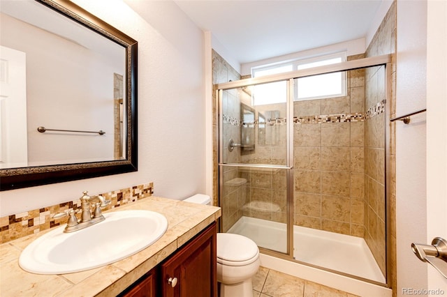 full bath featuring a shower stall, toilet, vanity, and tile patterned flooring
