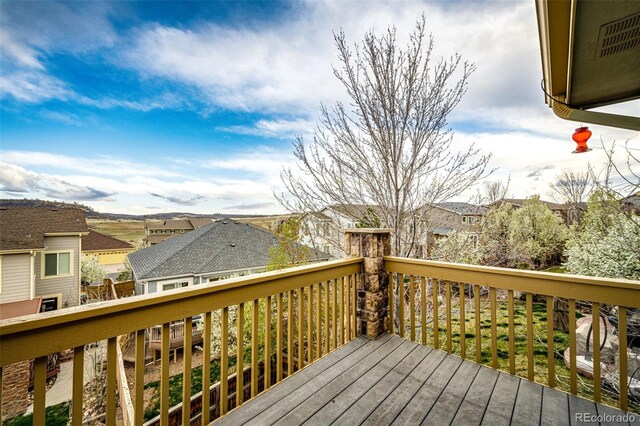 wooden deck with a residential view