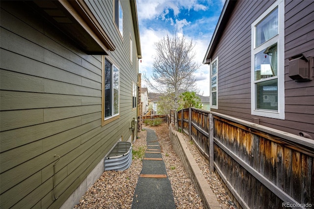 view of property exterior with fence