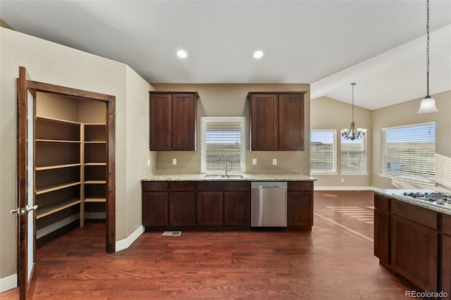 kitchen featuring light stone counters, dark wood-type flooring, sink, lofted ceiling, and stainless steel appliances