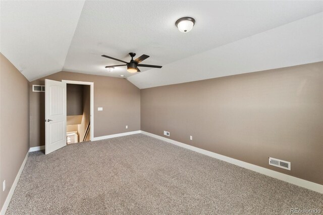 additional living space featuring lofted ceiling, ceiling fan, and carpet floors