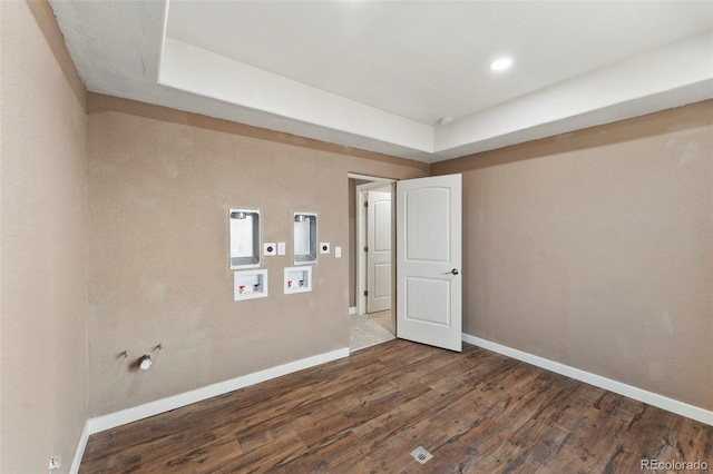 spare room featuring dark wood-type flooring