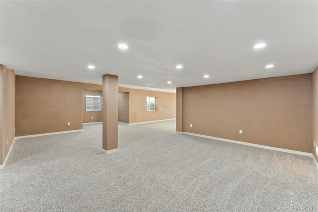 basement featuring light carpet