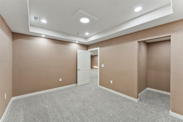 interior space with a tray ceiling