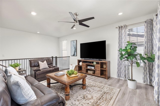 living area with a ceiling fan, recessed lighting, and light wood finished floors