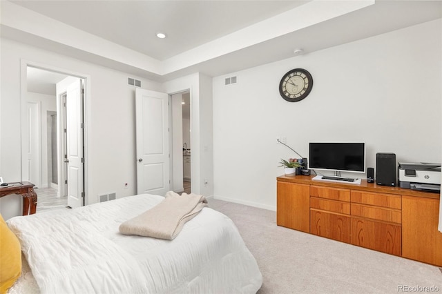 bedroom with light colored carpet, baseboards, and visible vents