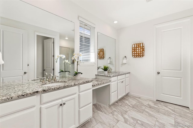 full bath with a shower with door, baseboards, marble finish floor, and vanity