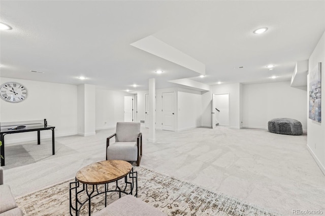 finished basement featuring light colored carpet, recessed lighting, and baseboards