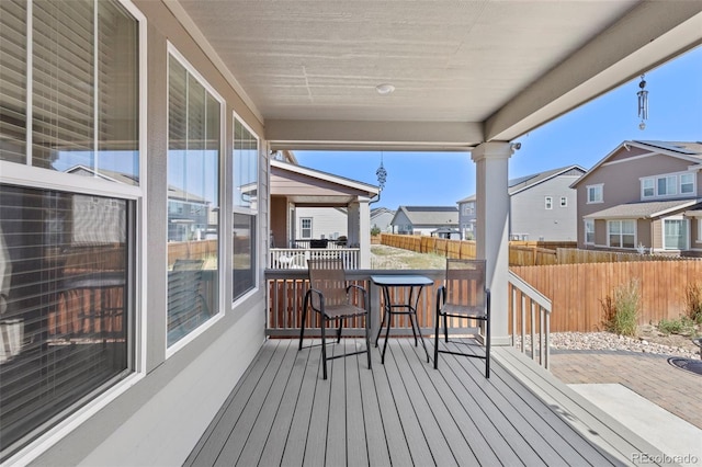 wooden deck with fence and a residential view
