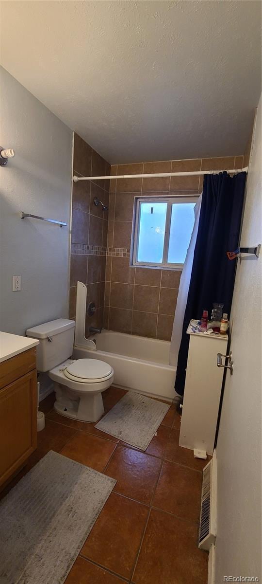 full bathroom with tile patterned floors, vanity, toilet, and shower / tub combo