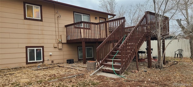 back of house featuring a wooden deck