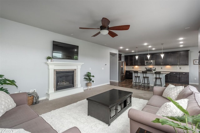 4025 Trail Stone Cir, Castle Rock, CO 80108 - carpeted living room featuring ceiling fan, recessed lighting, and a glass covered fireplace