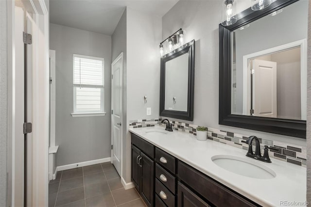 4025 Trail Stone Cir, Castle Rock, CO 80108 - full bathroom featuring double vanity, tile patterned floors, and decorative backsplash