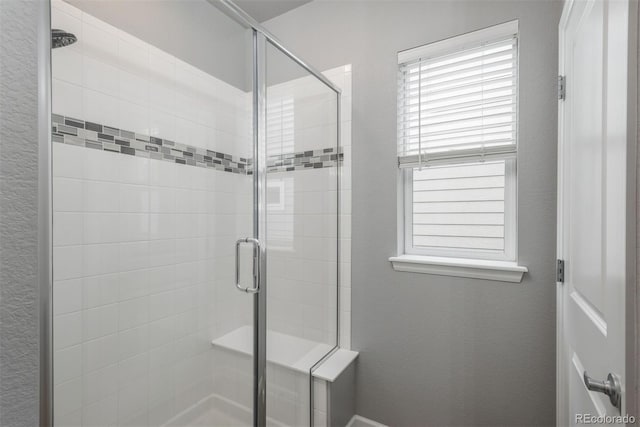 4025 Trail Stone Cir, Castle Rock, CO 80108 - bathroom featuring a shower stall and a textured wall