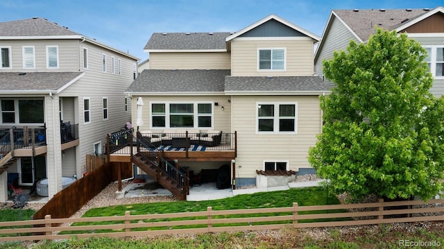4025 Trail Stone Cir, Castle Rock, CO 80108 - rear view of property with stairway, a fenced backyard, roof with shingles, a deck, and a patio