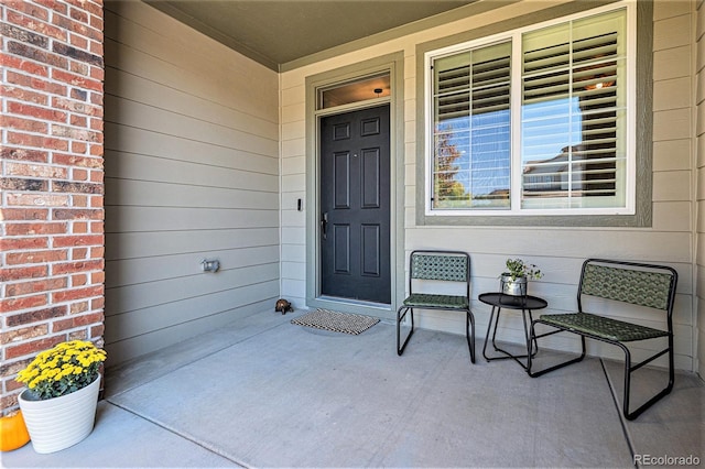 entrance to property featuring covered porch