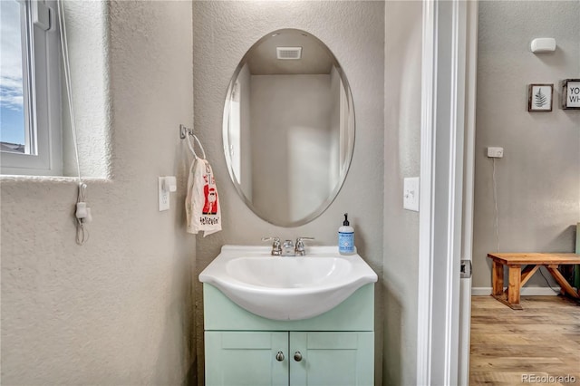 bathroom featuring vanity and hardwood / wood-style flooring