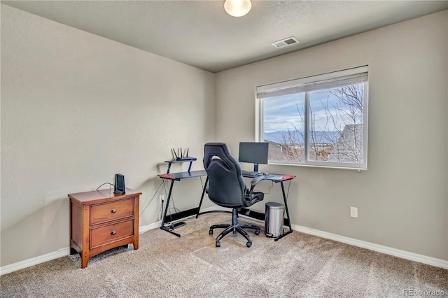 office space with light colored carpet