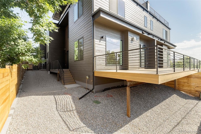 view of home's exterior with fence