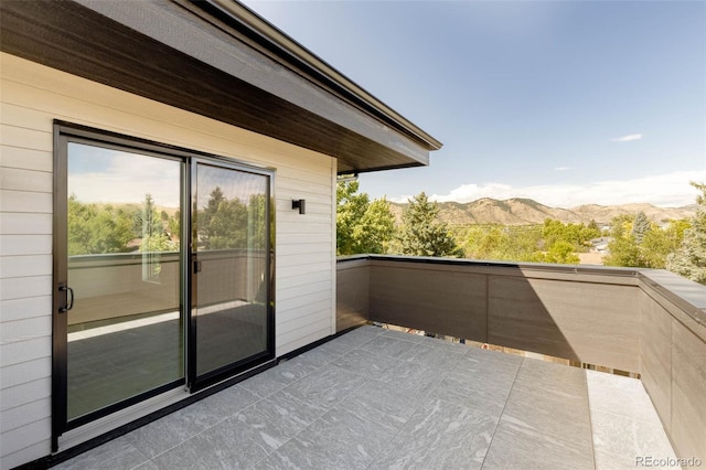 balcony featuring a mountain view