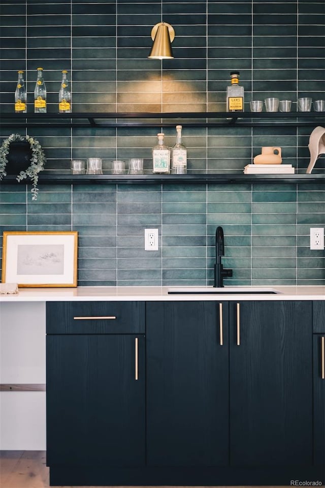 bar featuring a sink