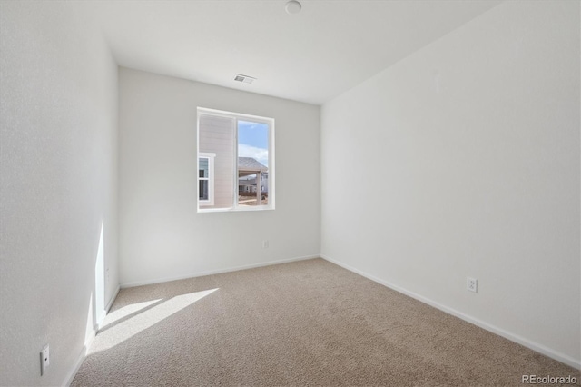 1306 Sienna Peak Cir, Erie, CO 80516 - unfurnished room with carpet floors, baseboards, and visible vents