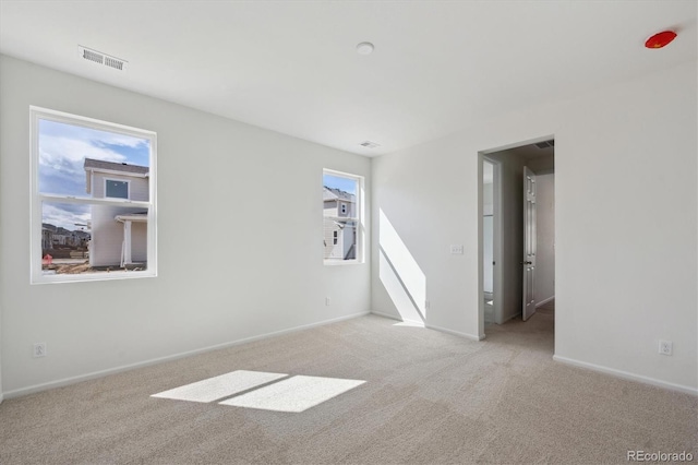 1306 Sienna Peak Cir, Erie, CO 80516 - unfurnished room featuring baseboards, visible vents, and carpet