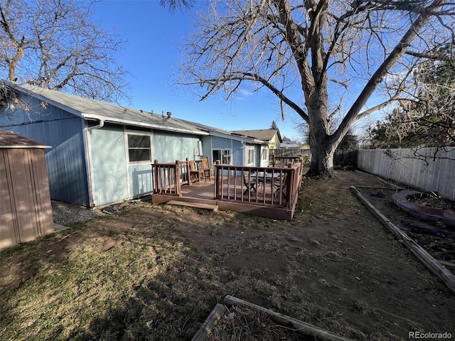 view of yard featuring a fenced backyard and a wooden deck