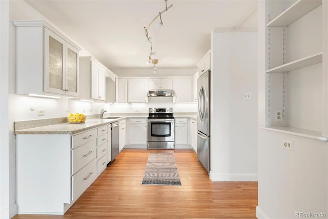 695 S Alton Way Unit 9C, Denver, CO 80247 - kitchen featuring appliances with stainless steel finishes, under cabinet range hood, and white cabinets